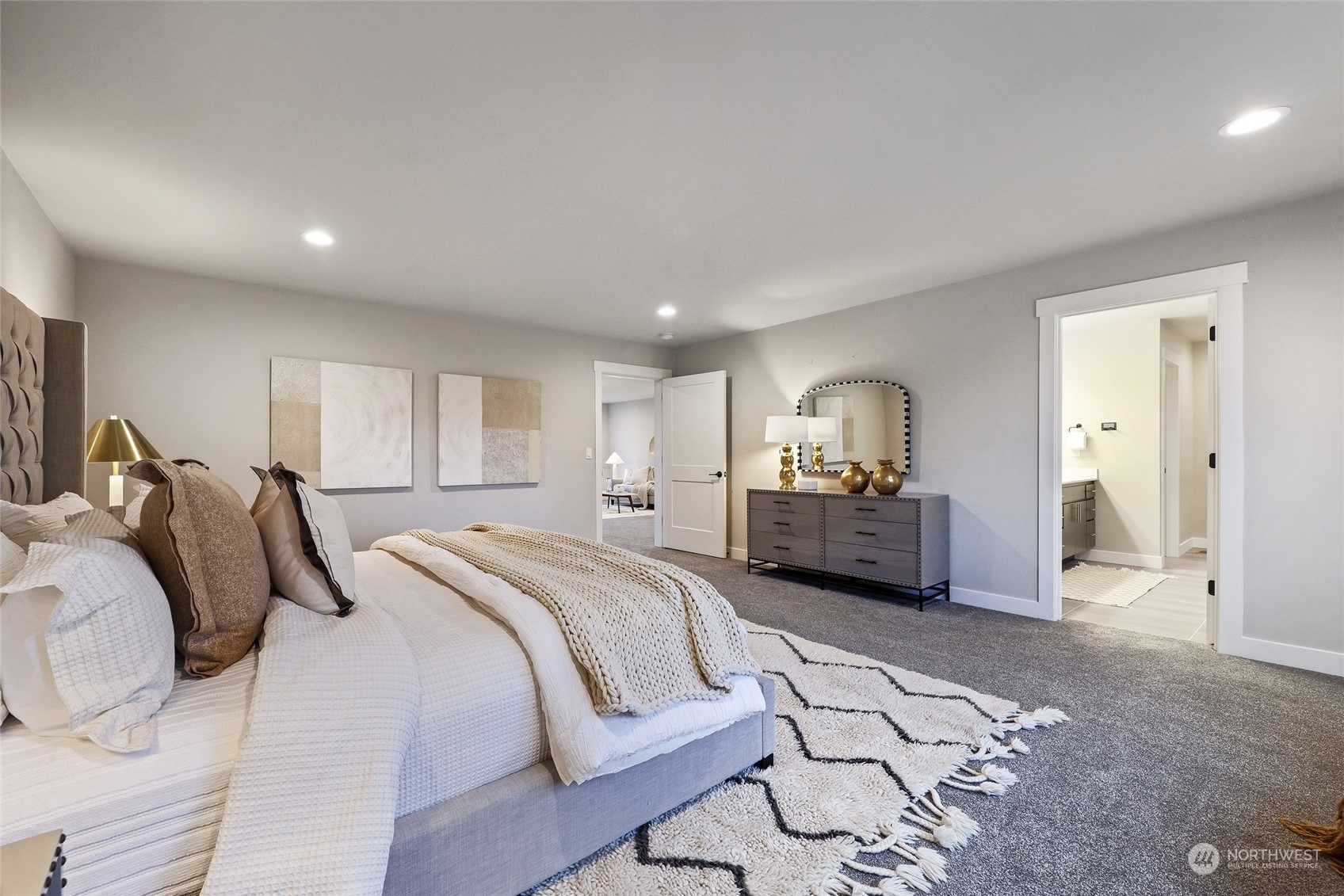 2 213th Street Southwest Bothell, WA 98021 - Photo 23 of 40 a spacious bedroom with a bed a lamp and a large window
