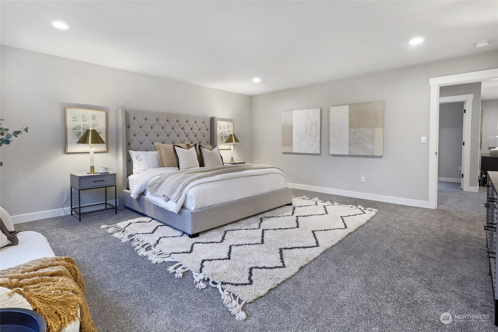 2 213th Street Southwest Bothell, WA 98021 - Photo 25 of 40 a spacious bedroom with a bed and a couch