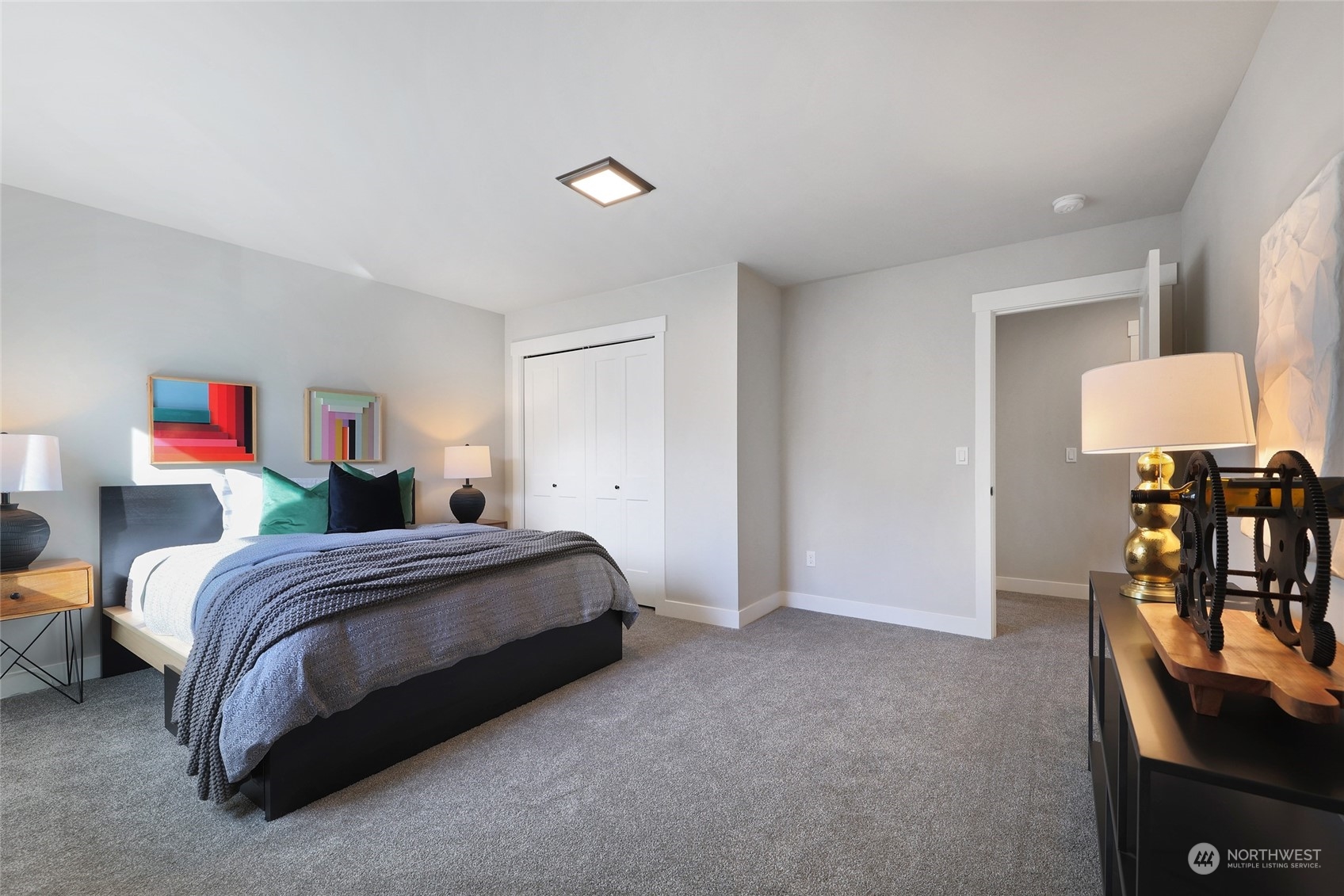 2 213th Street Southwest Bothell, WA 98021 - Photo 26 of 40 a spacious bedroom with a bed and chair