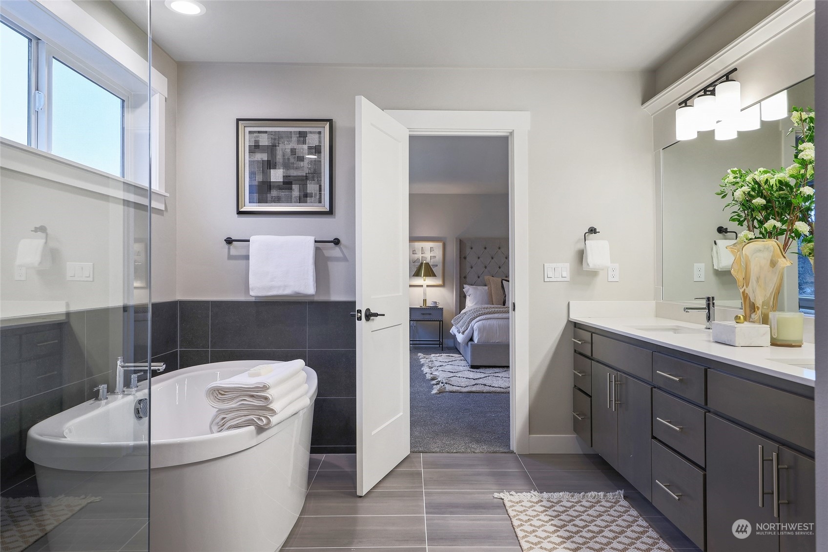 2 213th Street Southwest Bothell, WA 98021 - Photo 28 of 40 a spacious bathroom with a bathtub a sink and a mirror