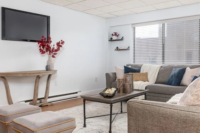 a living room with furniture and a window
