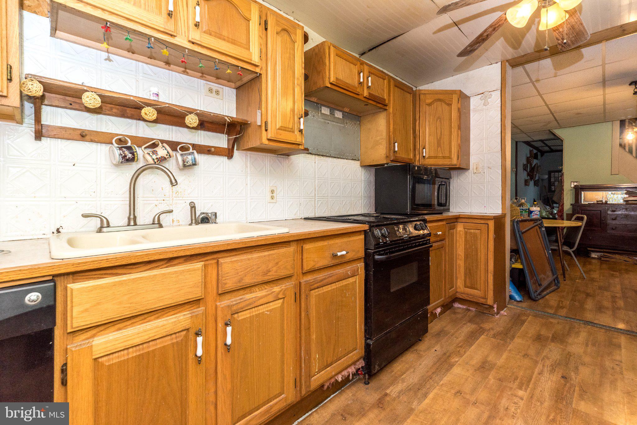 514 McKnight Street Gordon, PA 17921 - Photo 6 of 22 Cozy kitchen with classic wood cabinetry.