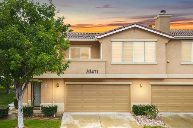 a front view of a house with garage