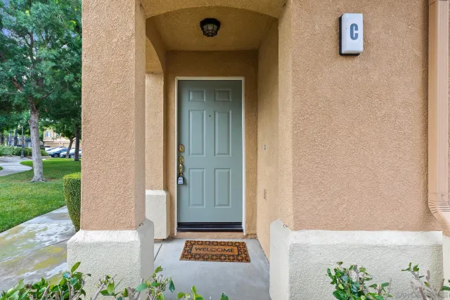 an aerial view of residential houses with outdoor space and city view