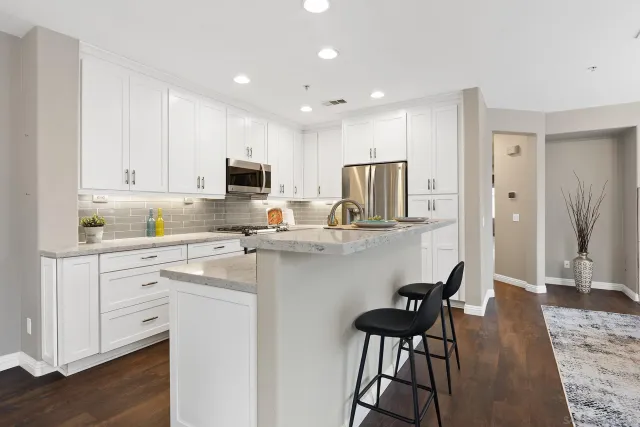 a view of a dining room with furniture wooden floor and chandelier