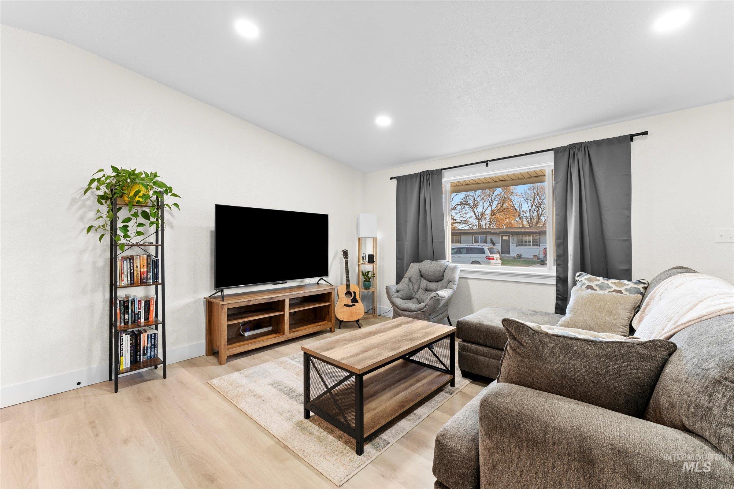 406 Chestnut Street Mountain Home, ID 83647 - Photo 16 of 31 Living area with light wood finished floors and recessed lighting