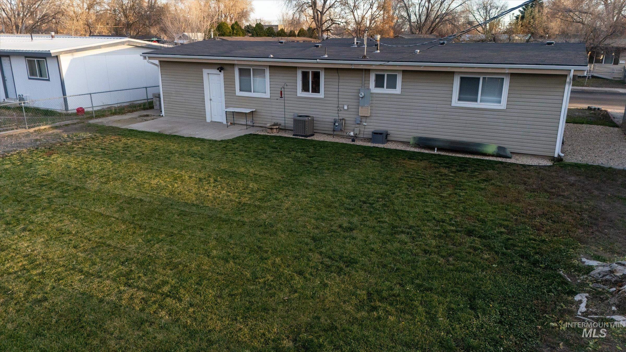 406 Chestnut Street Mountain Home, ID 83647 - Photo 25 of 31 Back of property featuring a patio