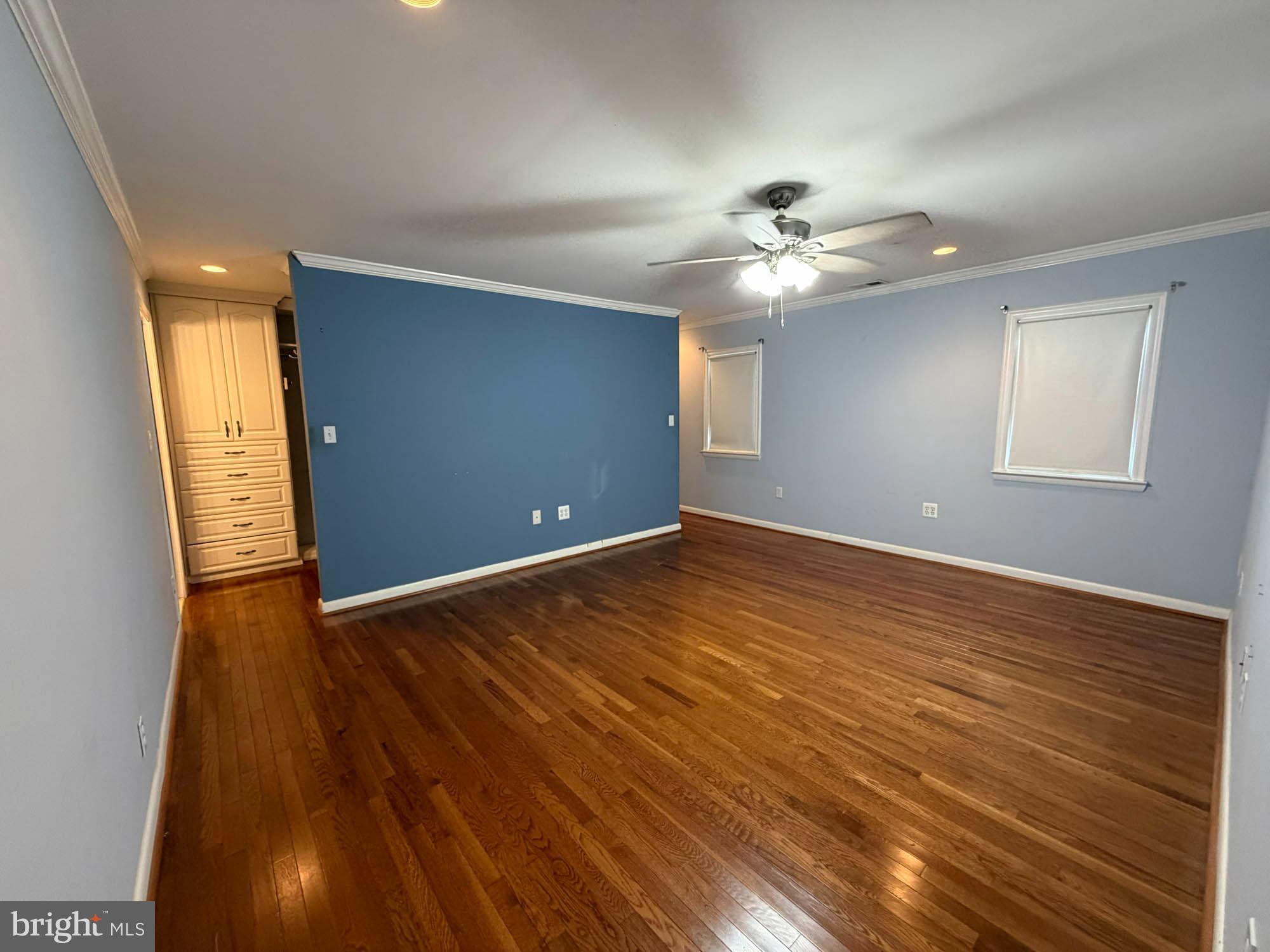 1129 Thompson Avenue Severn, MD 21144 - Photo 17 of 34 wooden floor in an empty room with a window