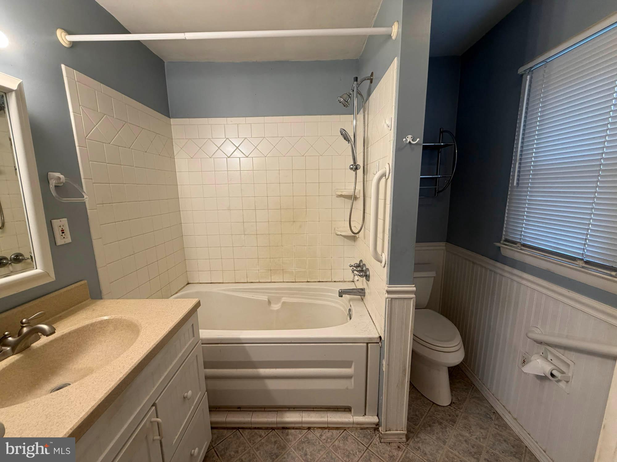 1129 Thompson Avenue Severn, MD 21144 - Photo 20 of 34 a bathroom with a granite countertop bathtub shower sink vanity and toilet