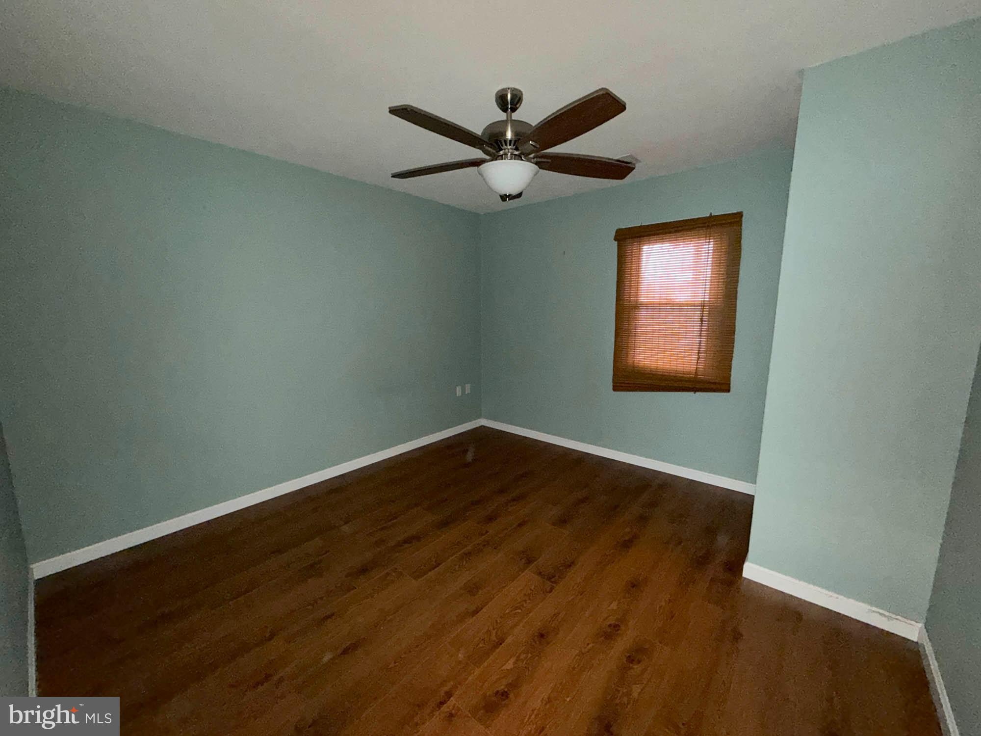 1129 Thompson Avenue Severn, MD 21144 - Photo 22 of 34 a view of empty room with wooden floor