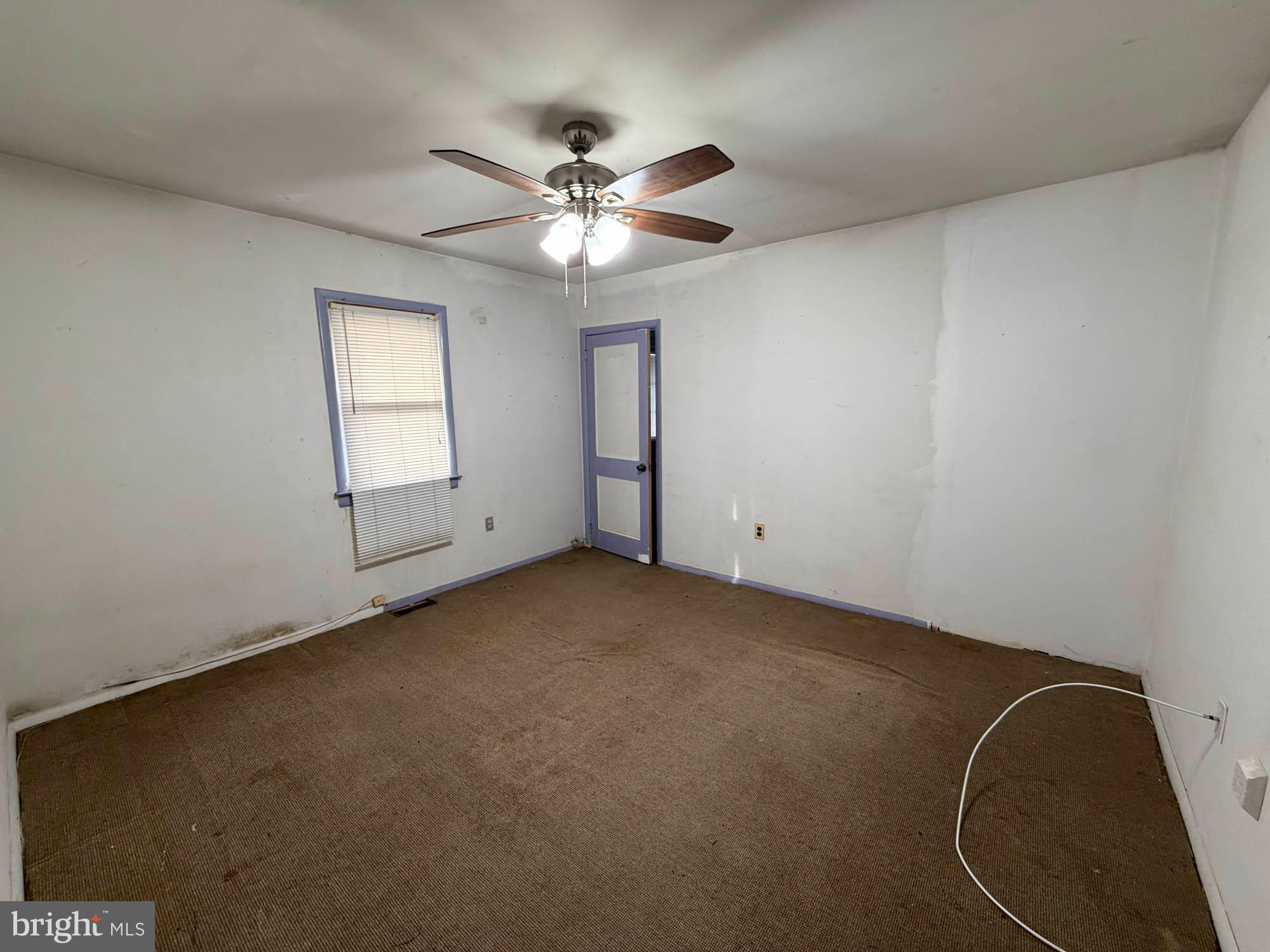 1129 Thompson Avenue Severn, MD 21144 - Photo 24 of 34 an empty room with windows and fan