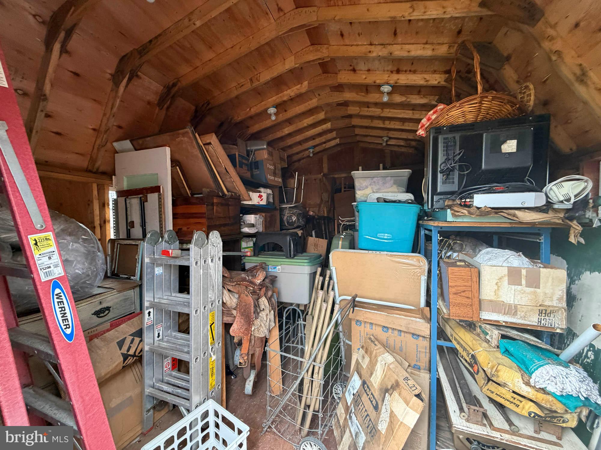 1129 Thompson Avenue Severn, MD 21144 - Photo 28 of 34 a view of walk in closet with clothes and shoes
