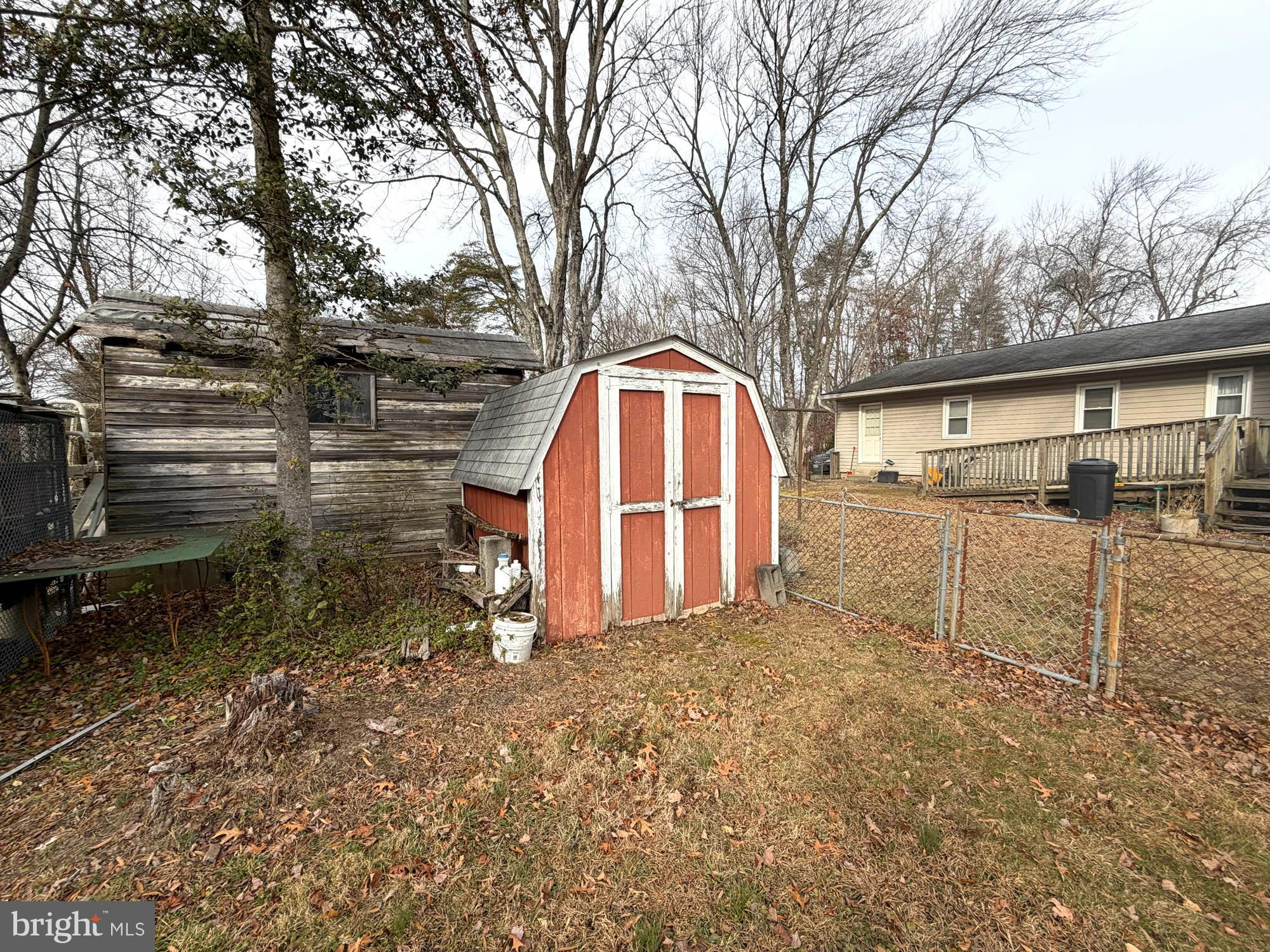 1129 Thompson Avenue Severn, MD 21144 - Photo 31 of 34 a backyard of a house with a yard and potted plants