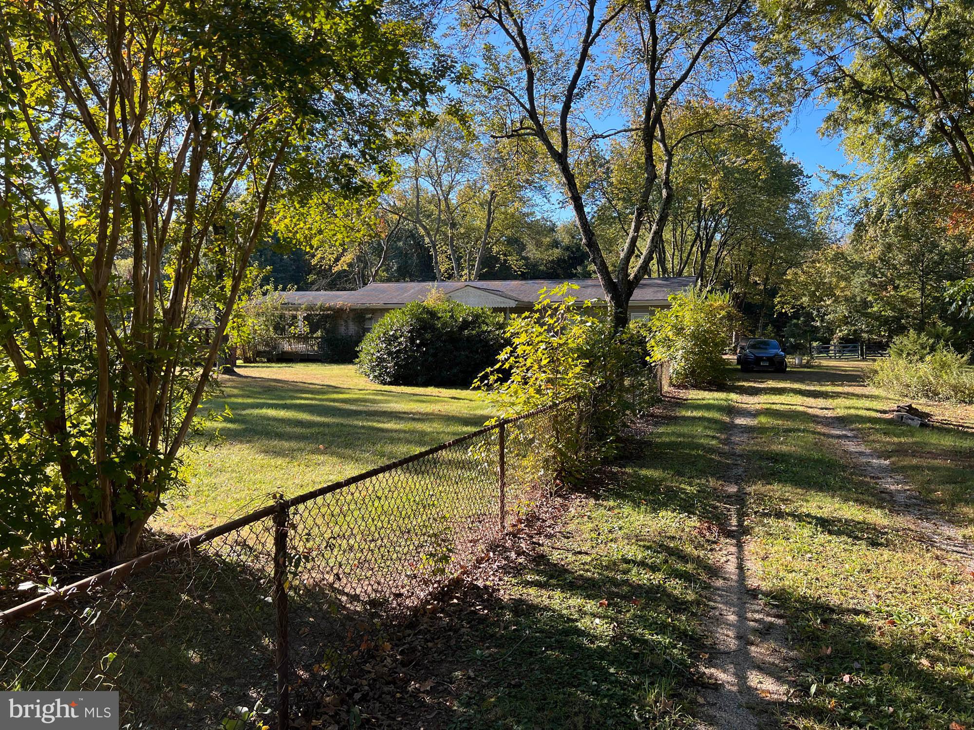 1129 Thompson Avenue Severn, MD 21144 - Photo 4 of 34 a view of a bench in the garden