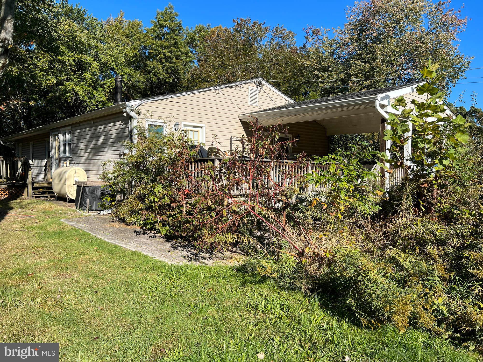 1129 Thompson Avenue Severn, MD 21144 - Photo 5 of 34 a view of a house with a yard and garden