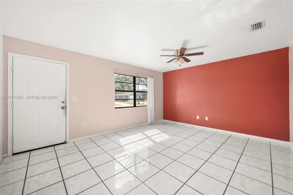a view of a livingroom with an empty space and window