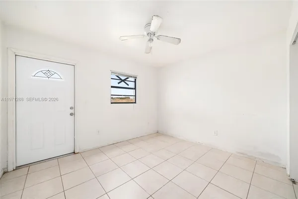 a view of an empty room with a window