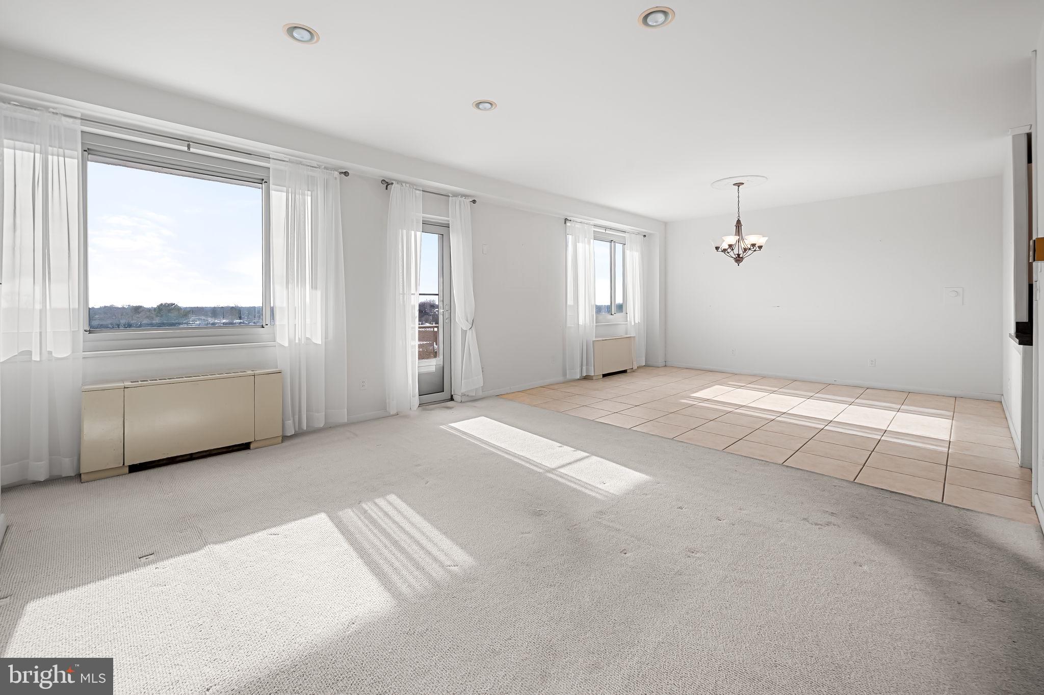 11 Slade Avenue, Unit 911 Pikesville, MD 21208 - Photo 8 of 35 Living Room/Dining Room