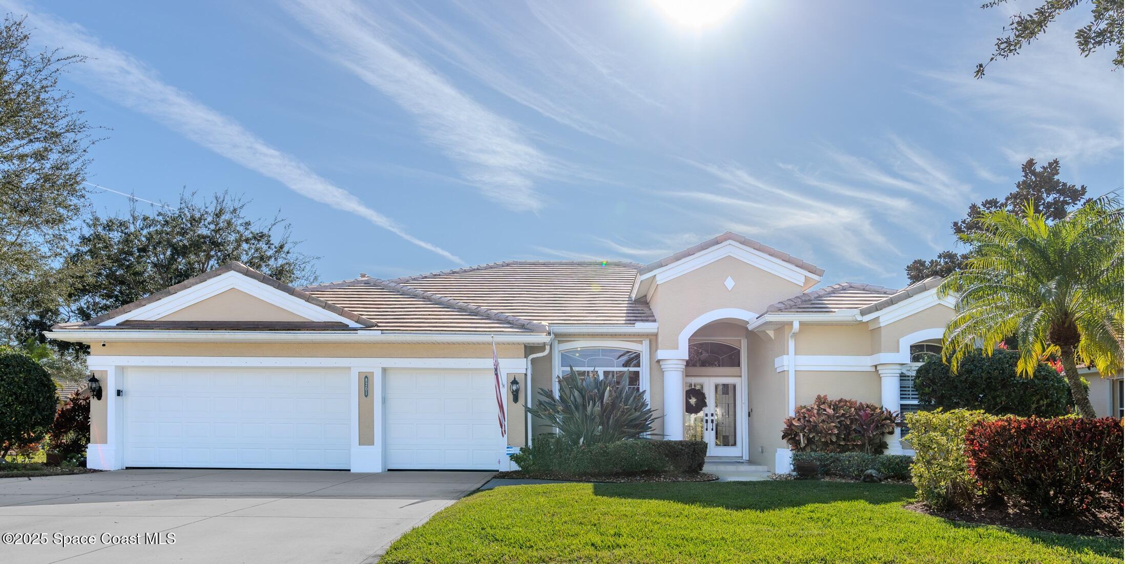 8201 Compton Way Melbourne, FL 32940 - Photo 40 of 52 a front view of a house with garden