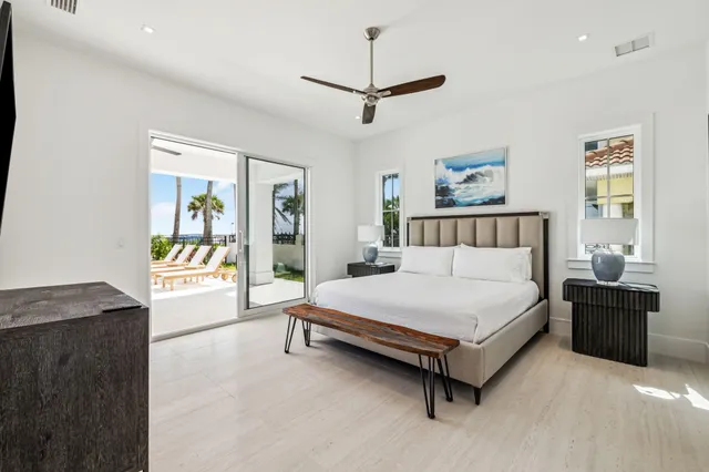 a spacious bedroom with a bed and a couch