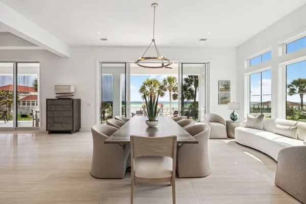 a living room with furniture a chandelier and a chandelier