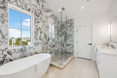 a bathroom with a bathtub and shower