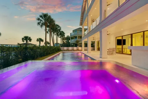 a view of swimming pool with outdoor seating and yard