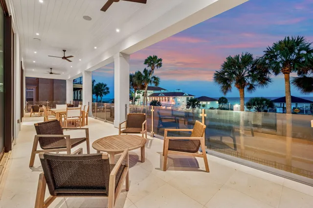 a dinning area with furniture and a potted plant
