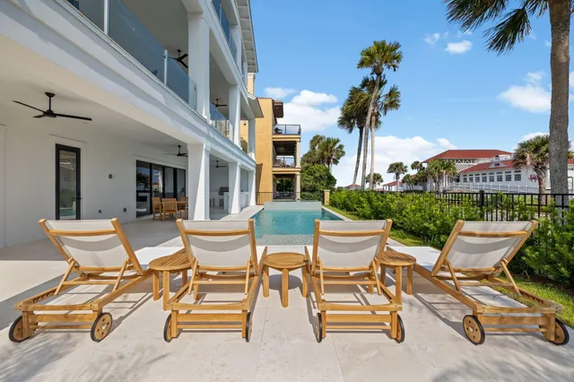 a view of a patio with a table and chairs