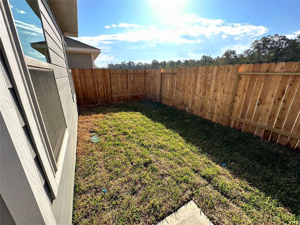 16662 Moss Lane Porter, TX 77365 - Photo 11 of 12 a view of balcony with wooden floor and fence
