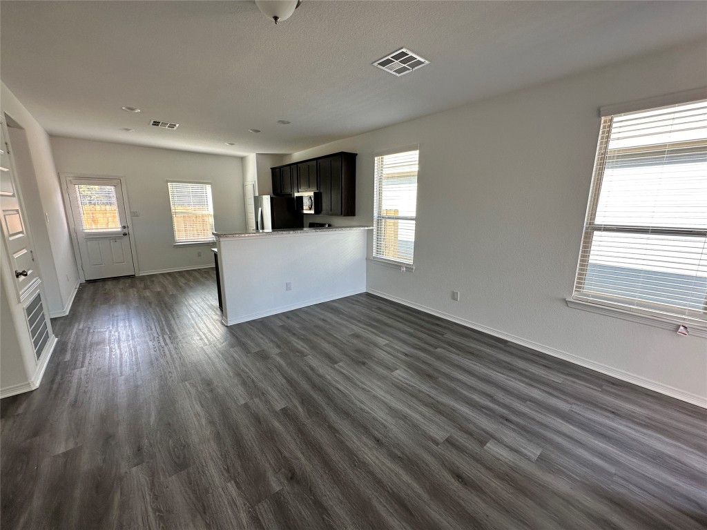 16662 Moss Lane Porter, TX 77365 - Photo 2 of 12 an empty room with wooden floor and windows