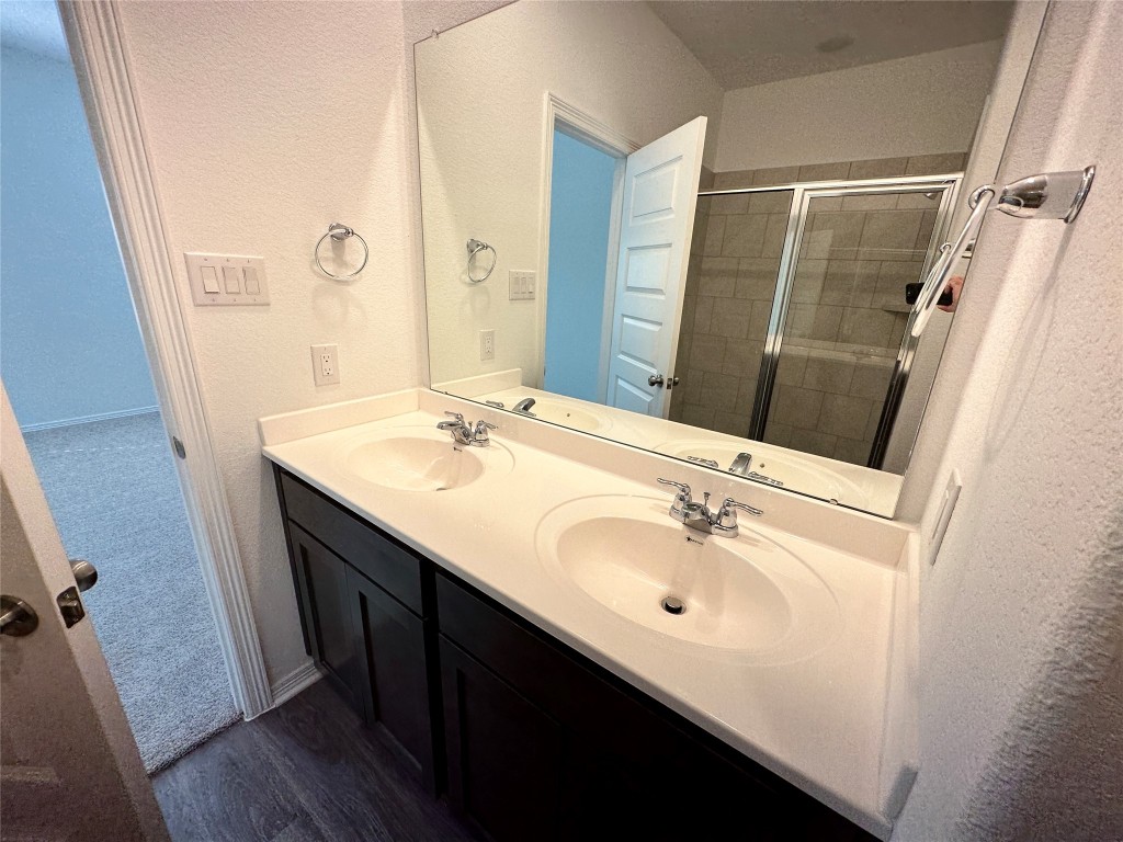 16662 Moss Lane Porter, TX 77365 - Photo 6 of 12 a bathroom with a sink a tub and a mirror