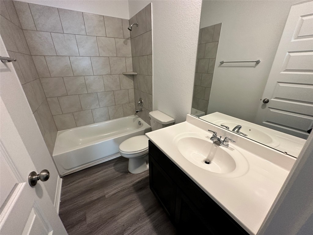 16662 Moss Lane Porter, TX 77365 - Photo 9 of 12 a bathroom with a sink a toilet and shower