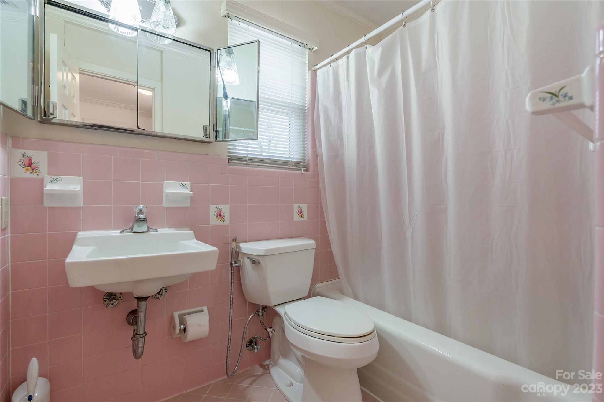 6916 Thermal Road Charlotte, NC 28211 - Photo 17 of 47 a bathroom with a toilet a sink and a mirror