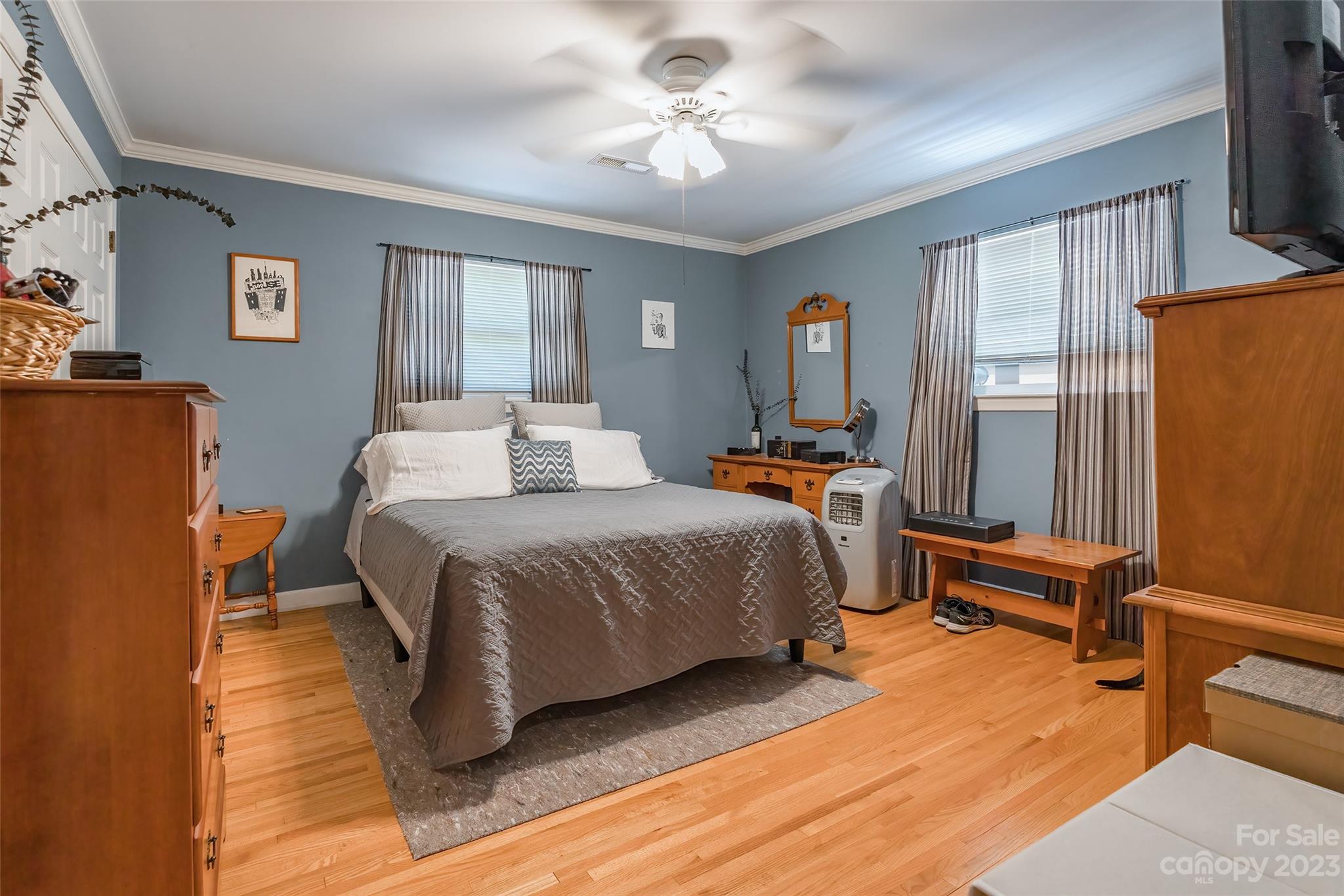 6916 Thermal Road Charlotte, NC 28211 - Photo 18 of 47 a bedroom with a bed and wooden floor