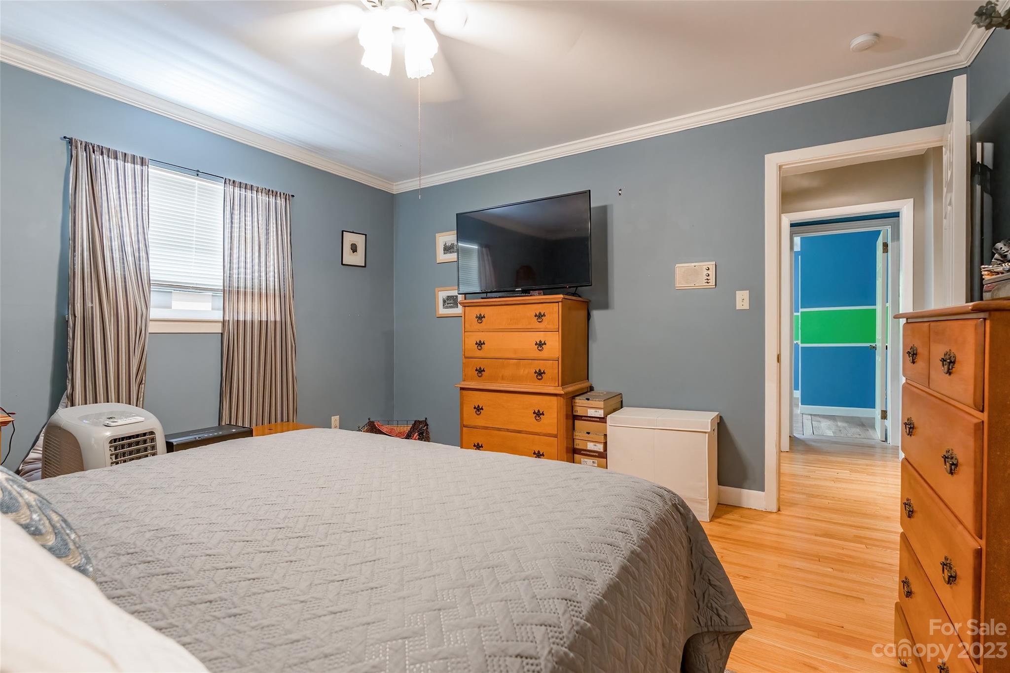 6916 Thermal Road Charlotte, NC 28211 - Photo 19 of 47 a bedroom with a bed and wooden floor