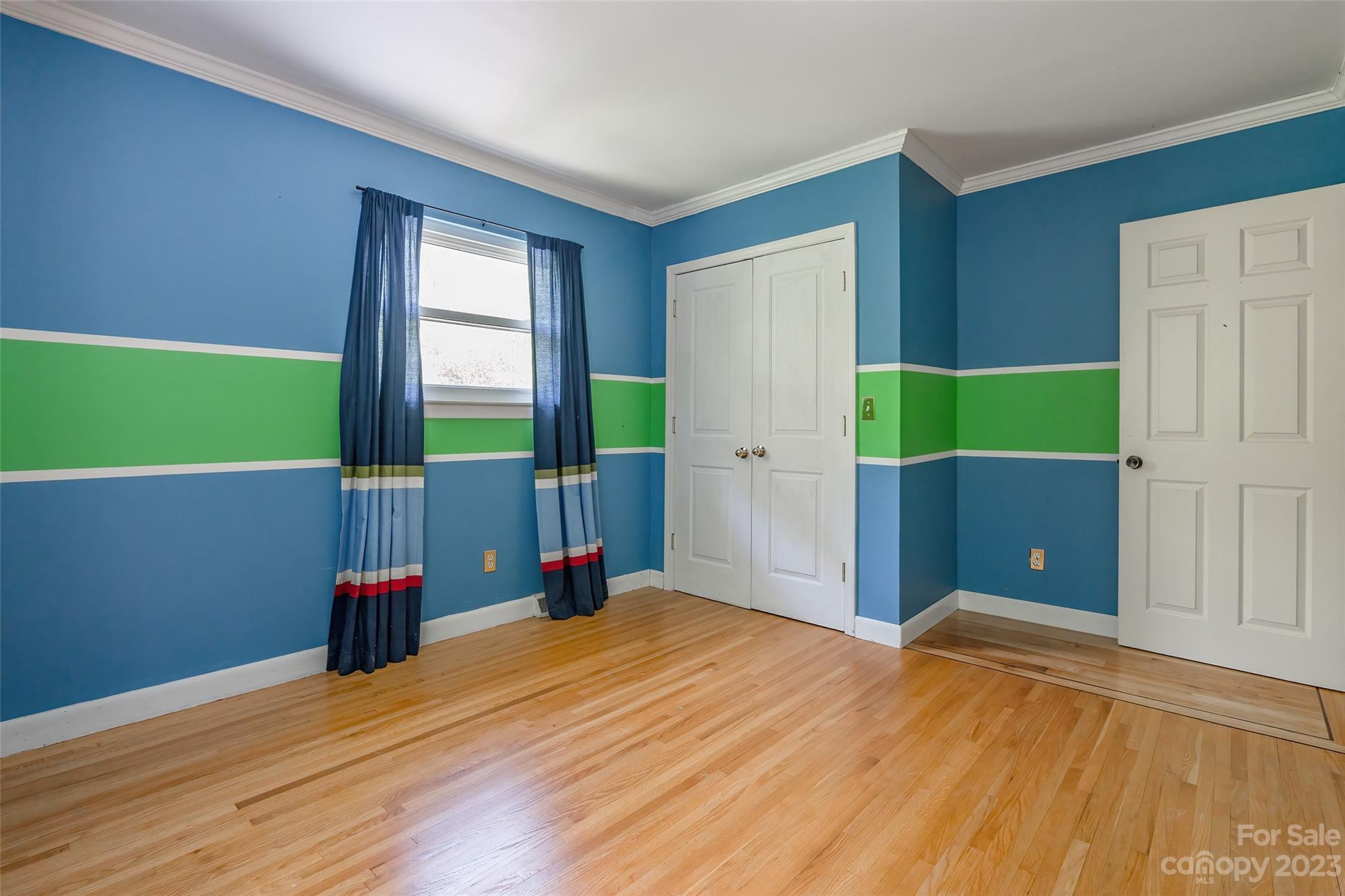 6916 Thermal Road Charlotte, NC 28211 - Photo 21 of 47 a view of empty room with wooden floor and fan
