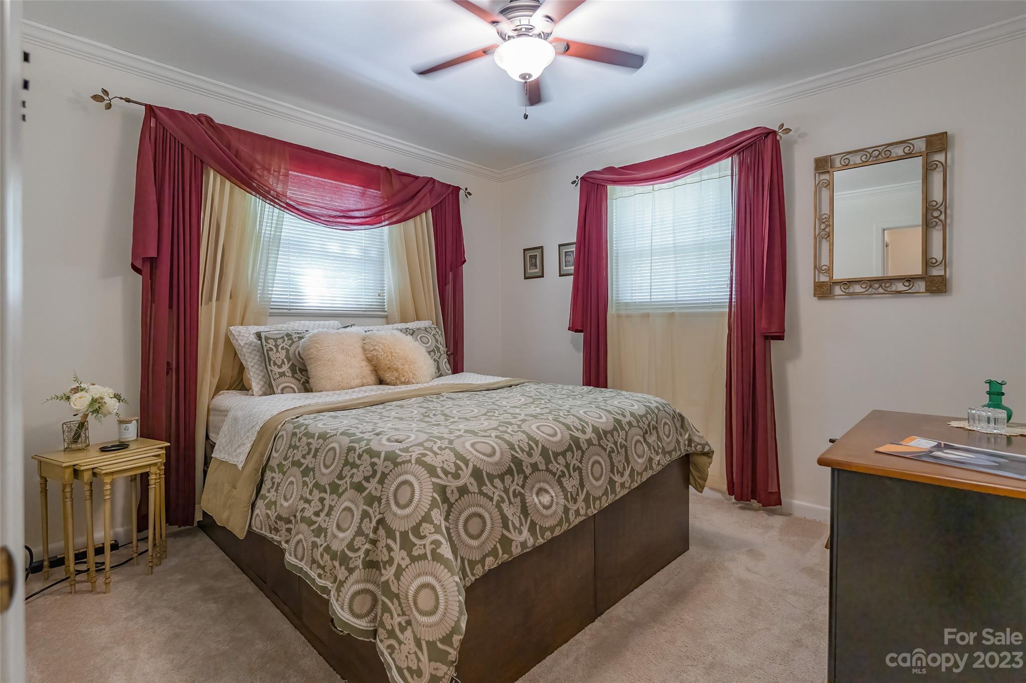6916 Thermal Road Charlotte, NC 28211 - Photo 26 of 47 a bedroom with a bed and a chandelier