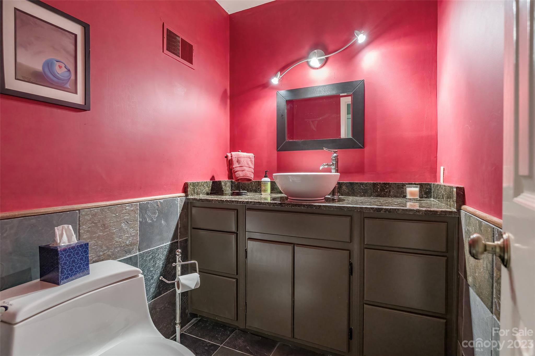 6916 Thermal Road Charlotte, NC 28211 - Photo 30 of 47 a bathroom with a sink and a mirror