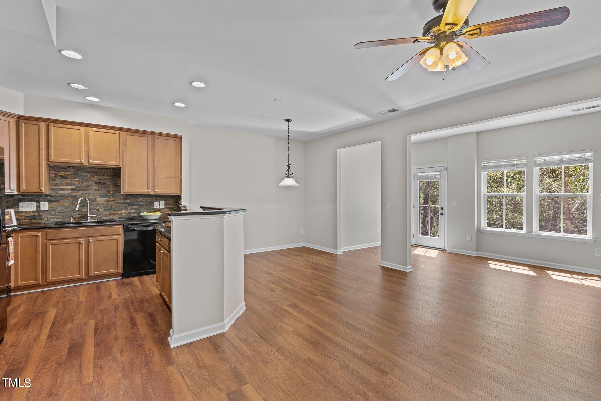439 Panorama View Loop Cary, NC 27519 - Photo 12 of 42 a kitchen with granite countertop a stove a sink and a refrigerator
