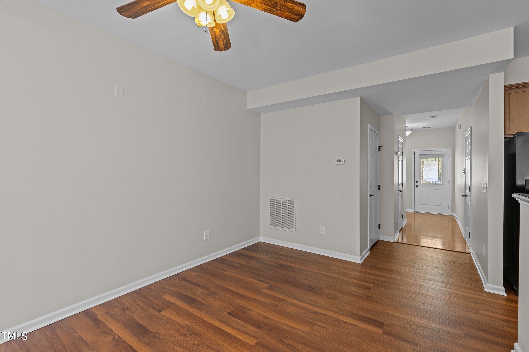 439 Panorama View Loop Cary, NC 27519 - Photo 14 of 42 a view of an empty room with wooden floor