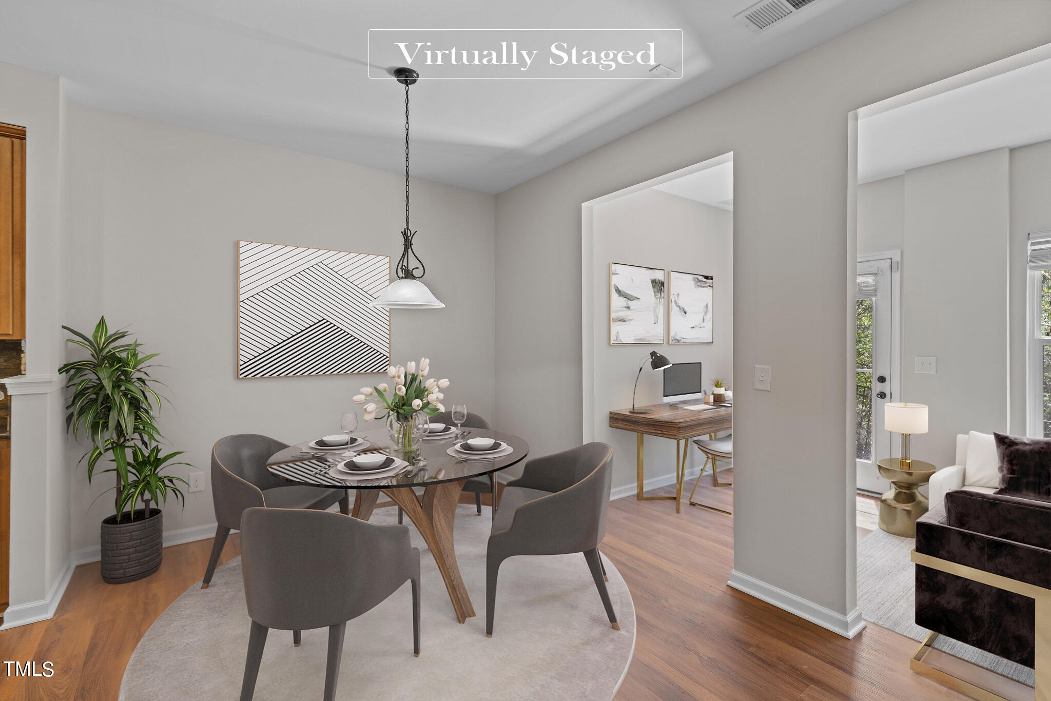 439 Panorama View Loop Cary, NC 27519 - Photo 15 of 42 a dining room with furniture potted plants and wooden floor
