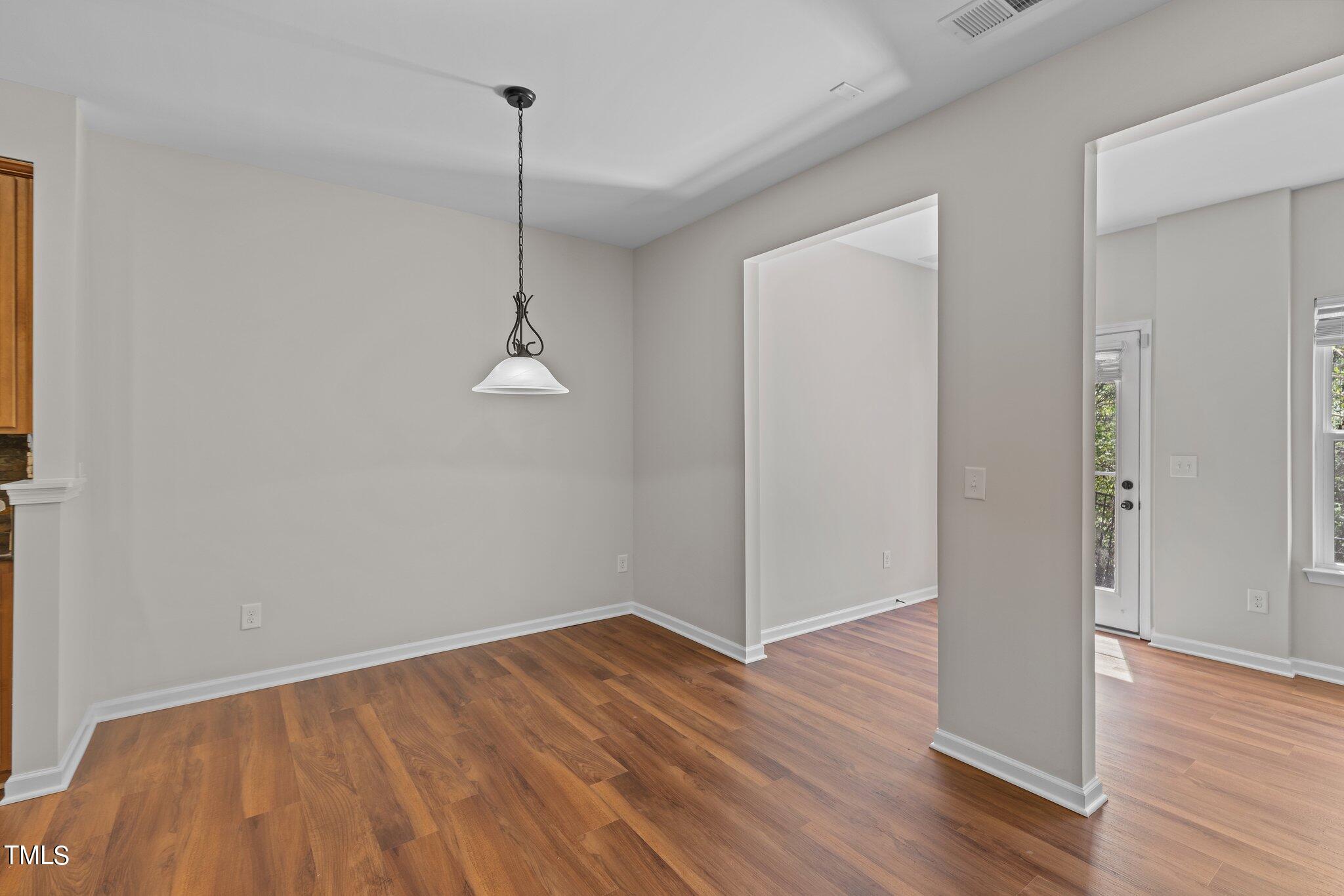 439 Panorama View Loop Cary, NC 27519 - Photo 16 of 42 a room view wooden floor and a ceiling fan