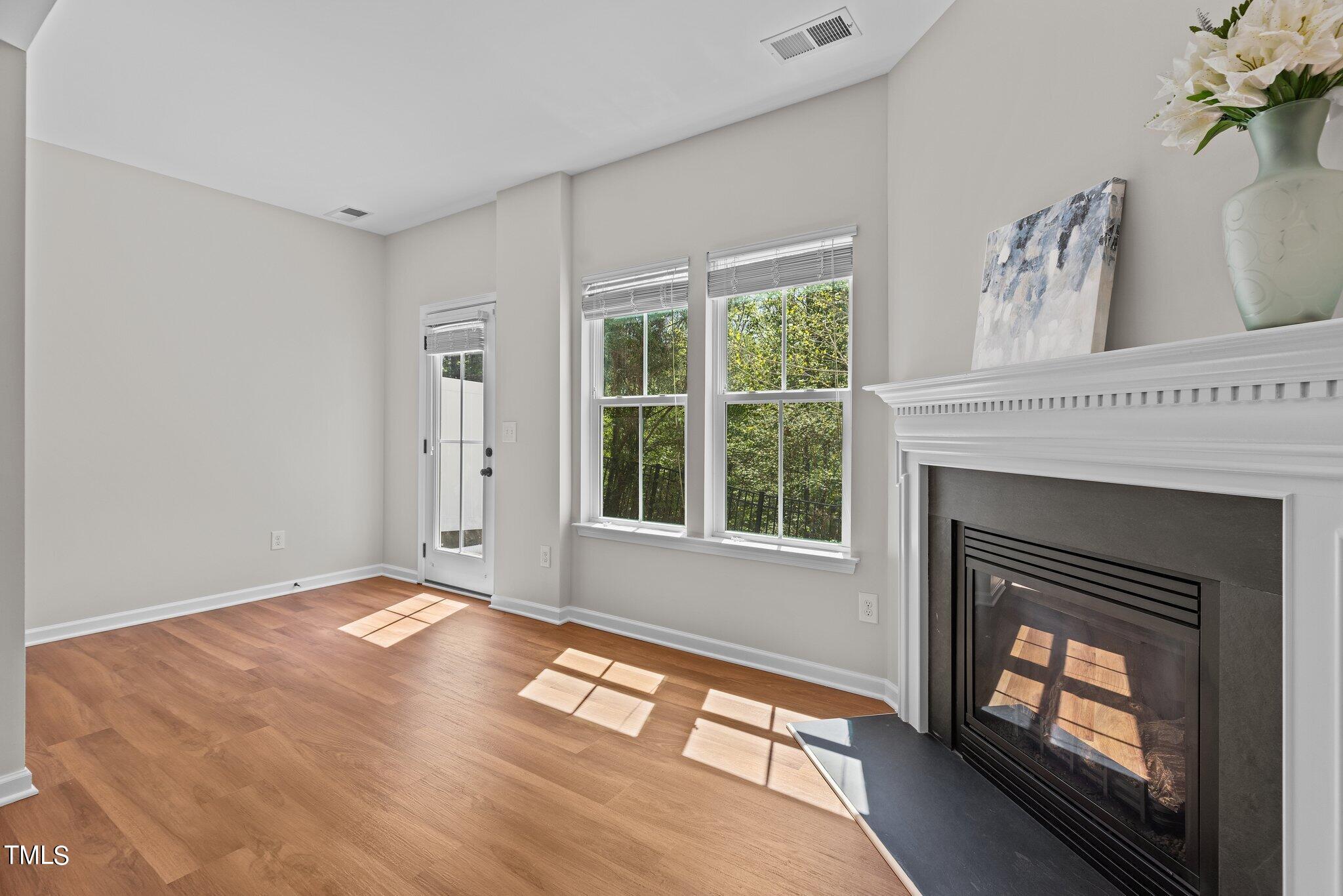 439 Panorama View Loop Cary, NC 27519 - Photo 21 of 42 a view of an empty room with a fireplace and a window