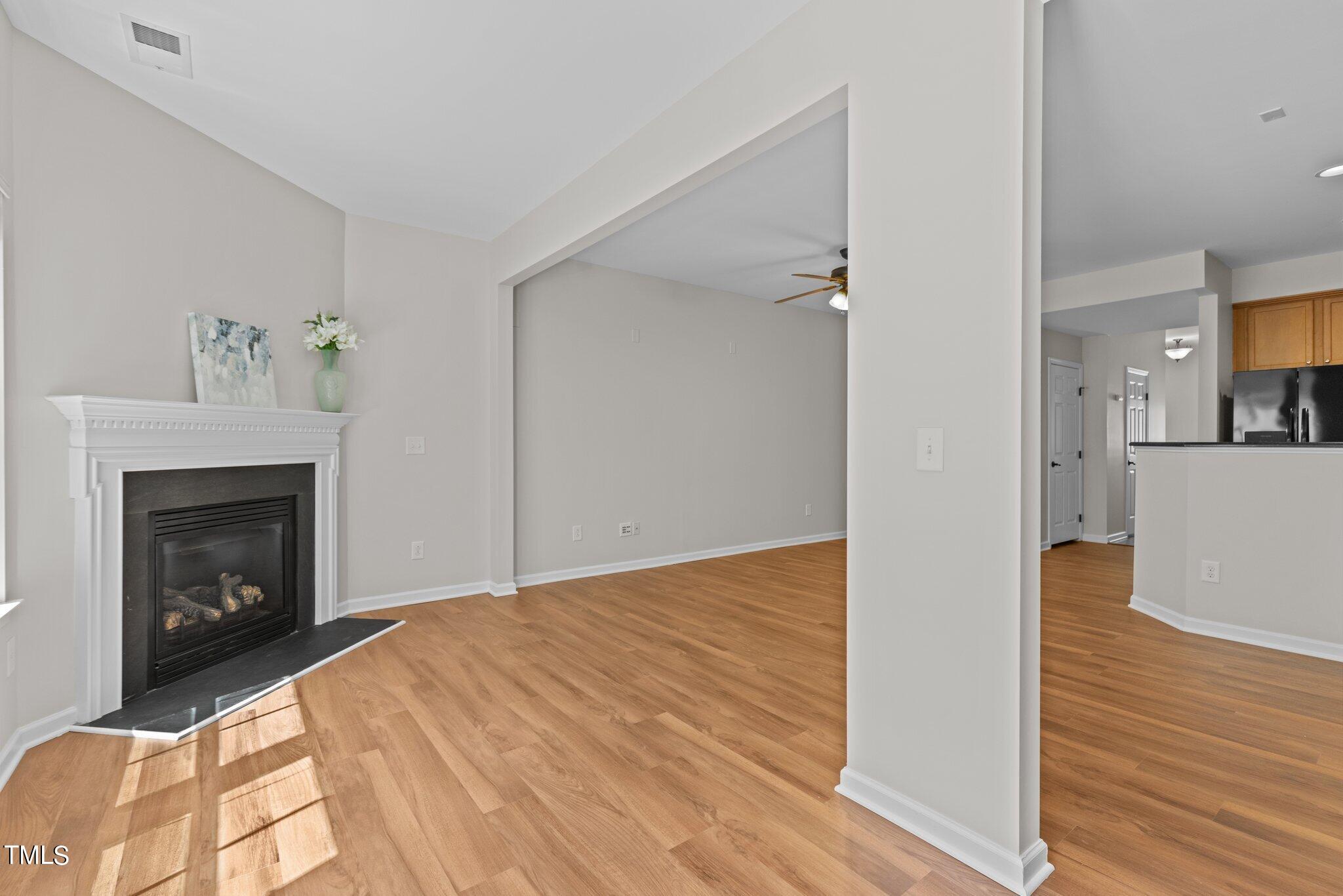 439 Panorama View Loop Cary, NC 27519 - Photo 22 of 42 a view of empty room with wooden floor and fireplace