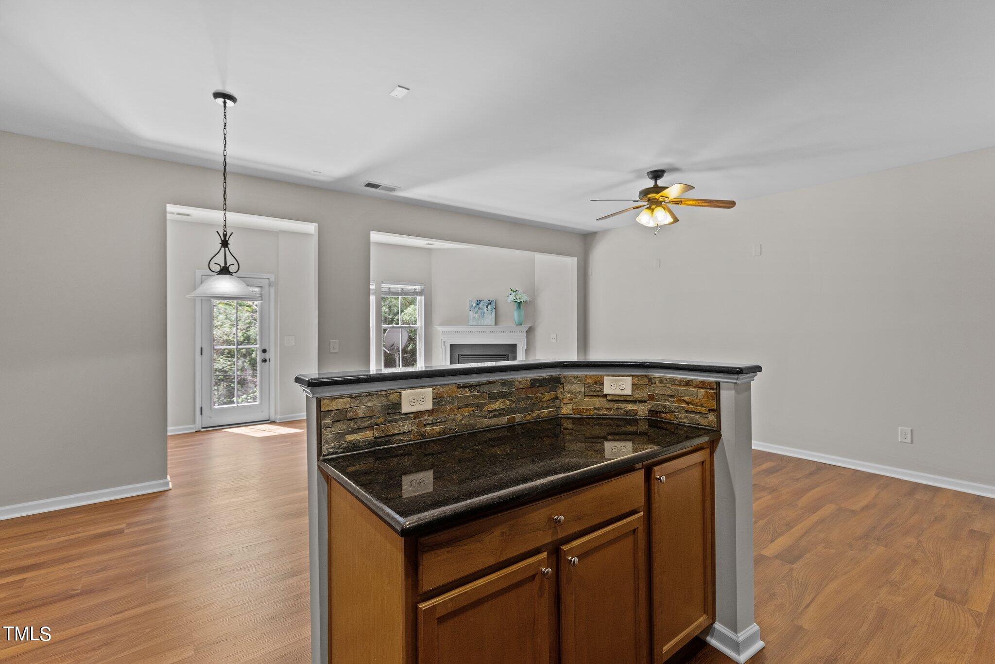 439 Panorama View Loop Cary, NC 27519 - Photo 8 of 42 a kitchen view of a stove and a wooden floor