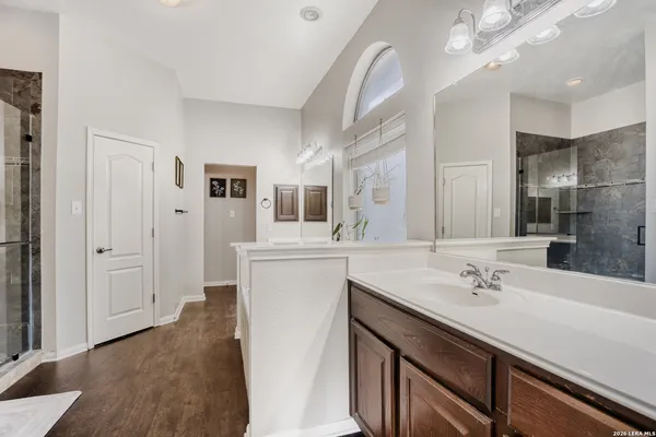 a bathroom with a sink double vanity and a mirror