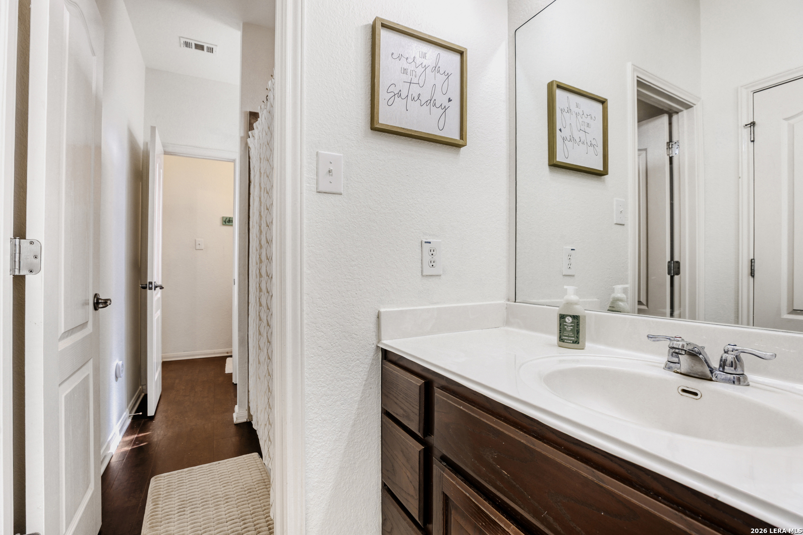 8330 Magdalena Run Helotes, TX 78023 - Photo 18 of 24 a bathroom with a sink and a mirror
