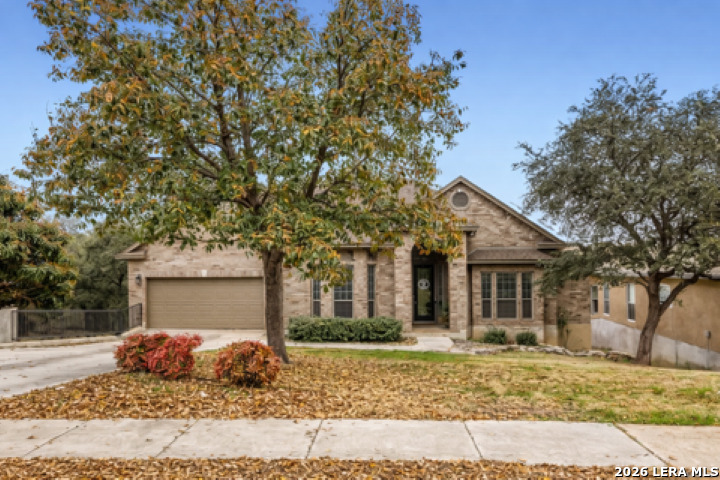 8330 Magdalena Run Helotes, TX 78023 - Photo 2 of 24 a front view of a house with a yard