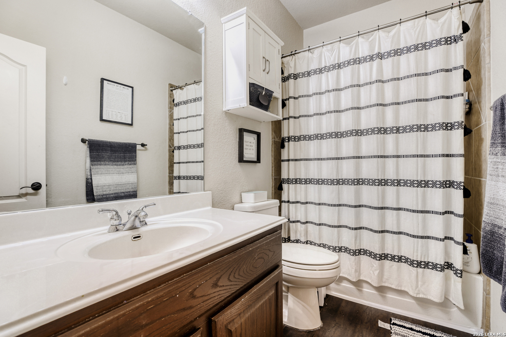8330 Magdalena Run Helotes, TX 78023 - Photo 21 of 24 a bathroom with a sink a toilet and shower